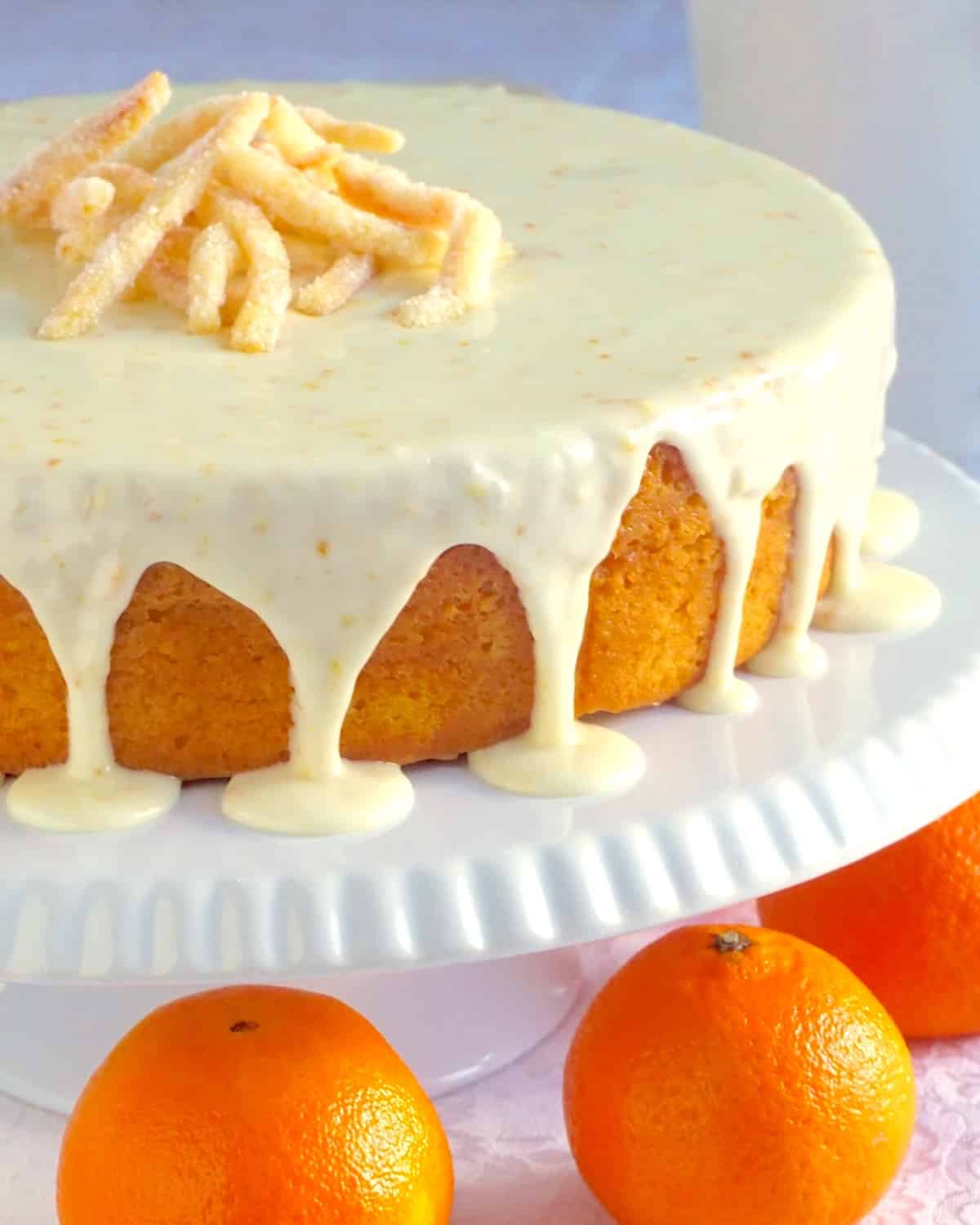 Clementine Cake close up shot photo of completed cake on a white cake pedestal