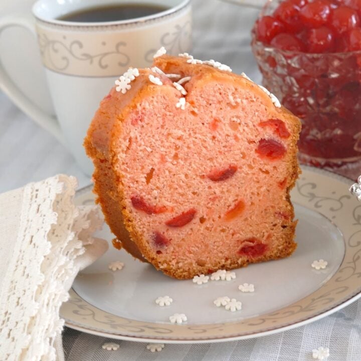 Close up photo of one slice of Maraschino Cherry Almond Pound Cake for featured image.