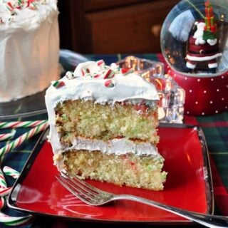 Candy Cane Cake photo of a single slice on a red plate.