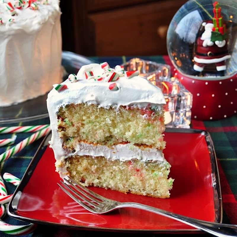 Candy Cane Cake photo of a single slice on a red plate.
