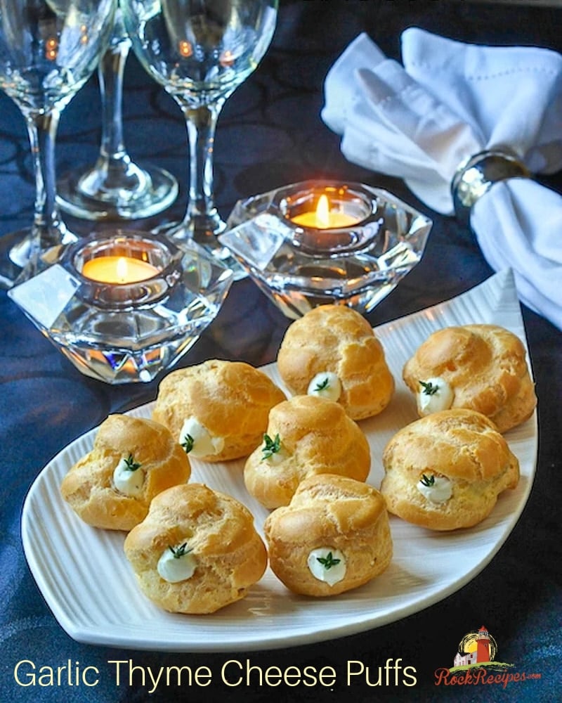 Garlic Thyme Cheese Puffs shown with candles and title text added for social media.