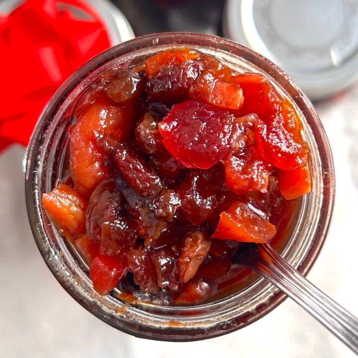 Jamaican Black Cake fruit preparation overhead shot of open bottle