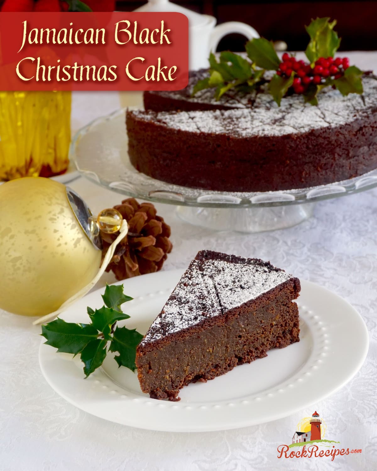 Newfoundland Jamaican Black Christmas Cake wide shot of one slice with whole cake in background and title trext added for Social media