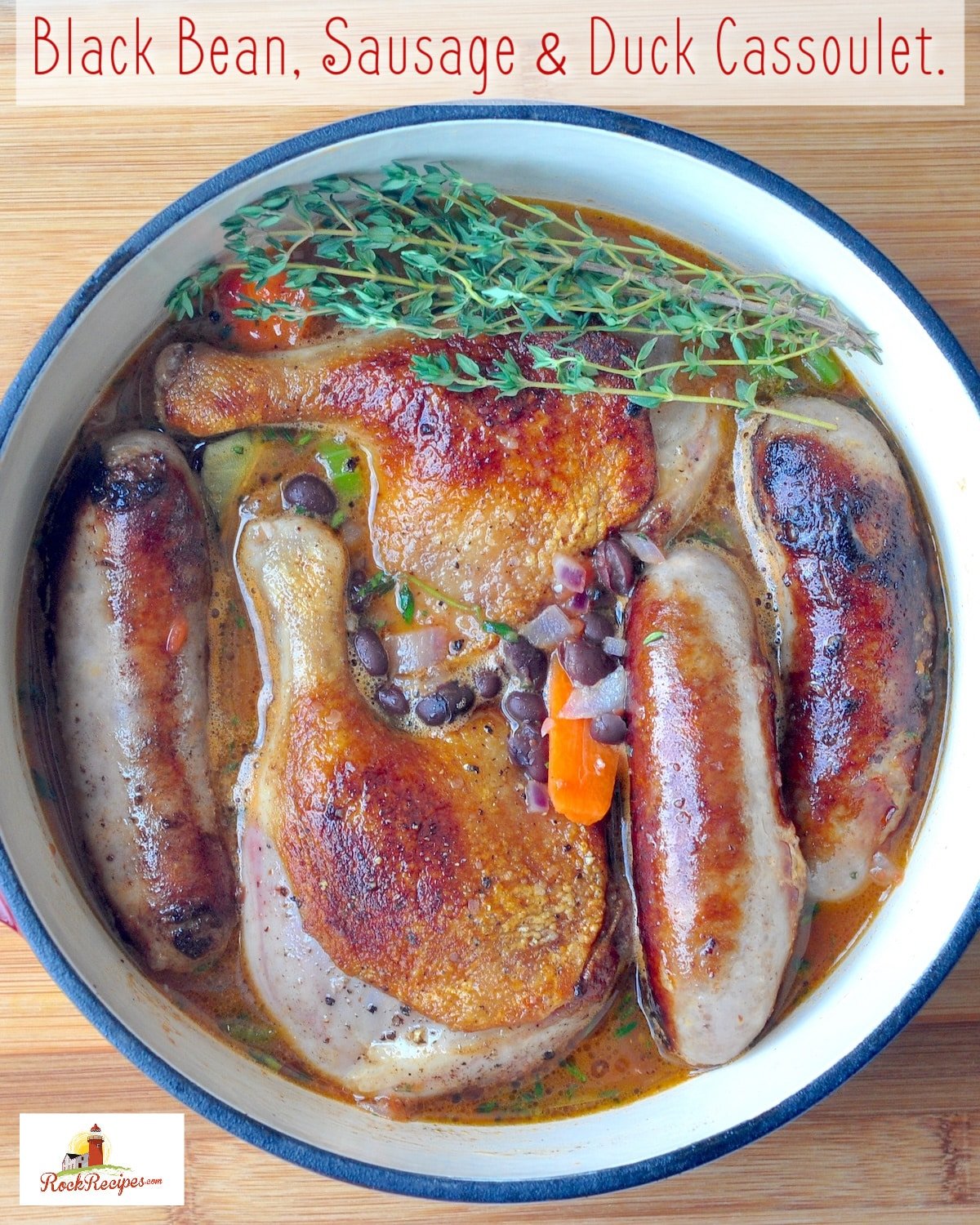 Black Bean, Sausage & Duck Cassoulet pictured in a dutch oven with title text added for social media