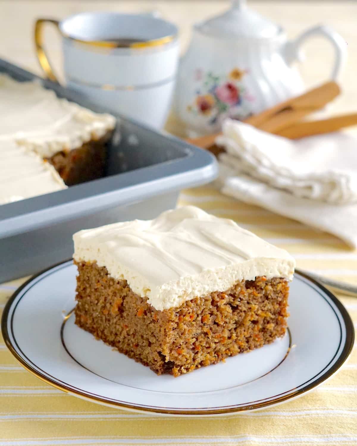 One slice of Quick Carrot Cake on a gold trimmed plate.