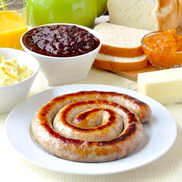 Cumberland sausage shown cooked in a traditional link coil for featured Google image