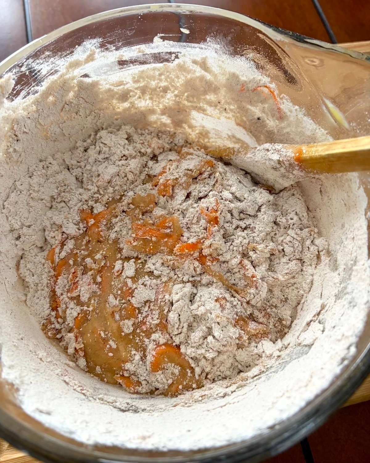 Gently folding in the dry ingredients for Quick Carrot Cake.