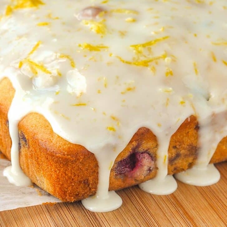 Lemon Drizzle Cake photo of uncut coke with dripping glaze over the sides