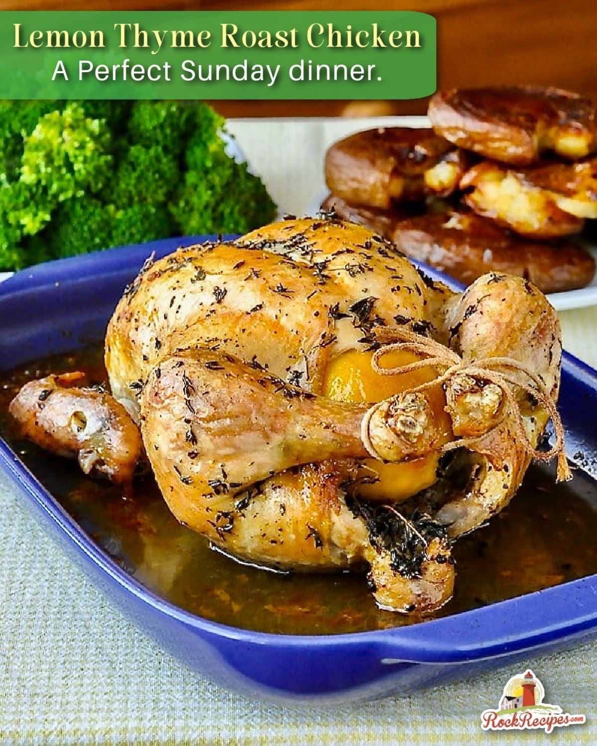 Lemon Thyme Roast Chicken, just out of the oven on a blue ceramic roasting tray with title text added for Pinterest and social media posts.