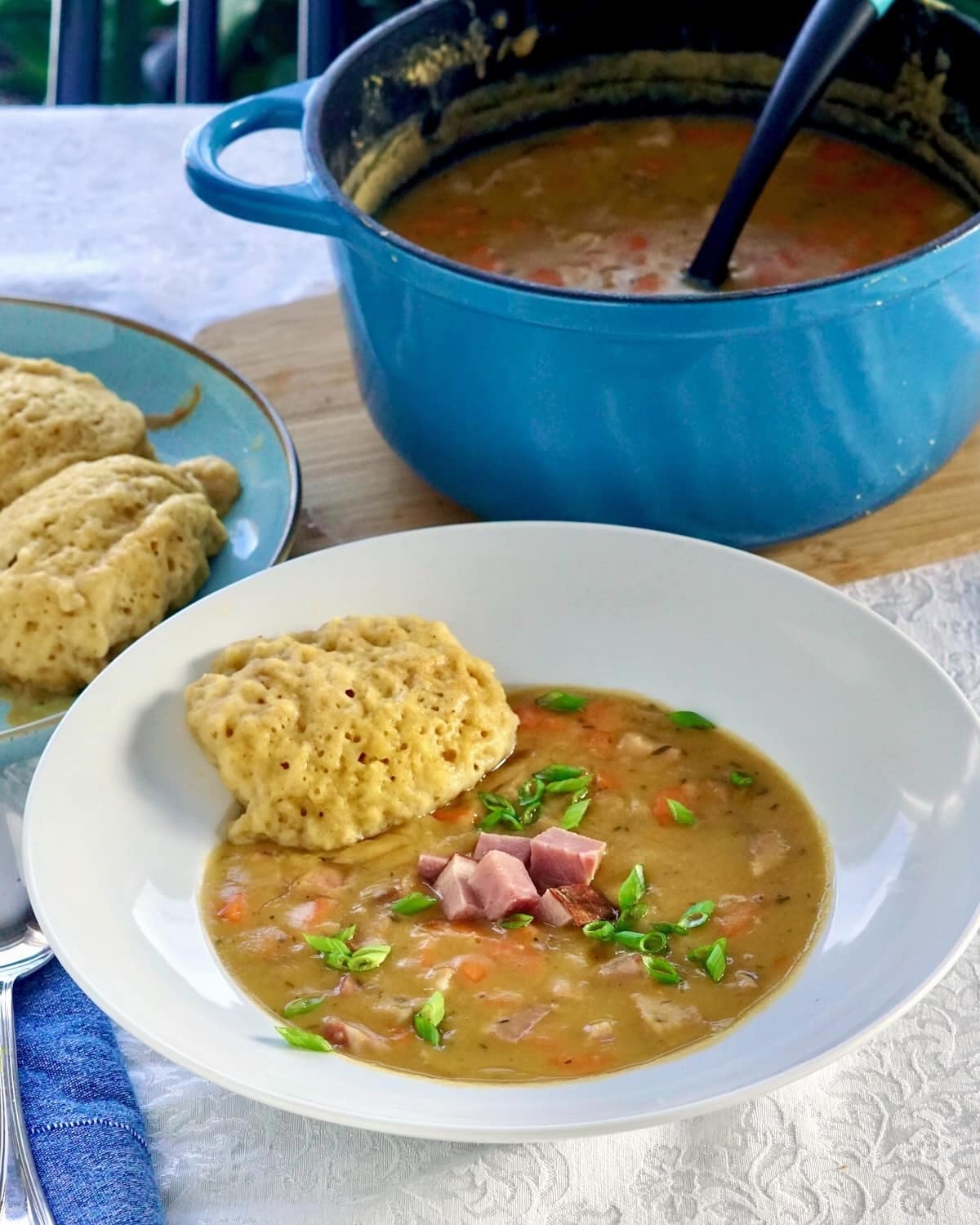 Newfoundland Pea Soup and Dough Boys with blue enamelled cast iron pot in background.