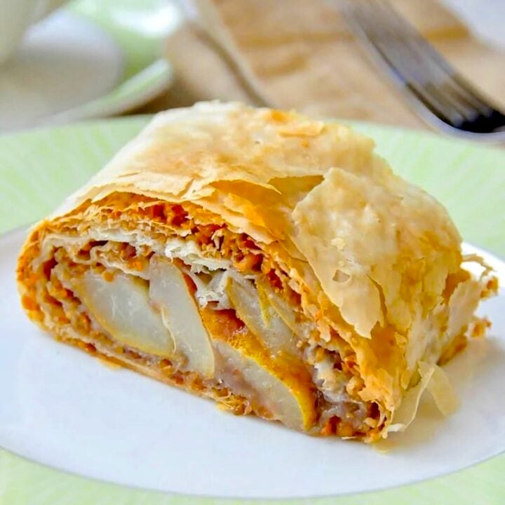 Pear Almond Baklava Roll close up of single serving on green edged plate