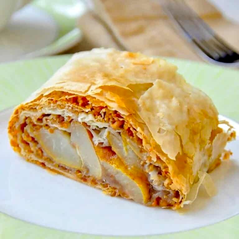 Pear Almond Baklava Roll close up of single serving on green edged plate
