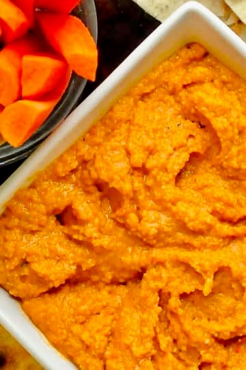 Roasted Red Pepper Hummus close up photo of hummus in a white bowl