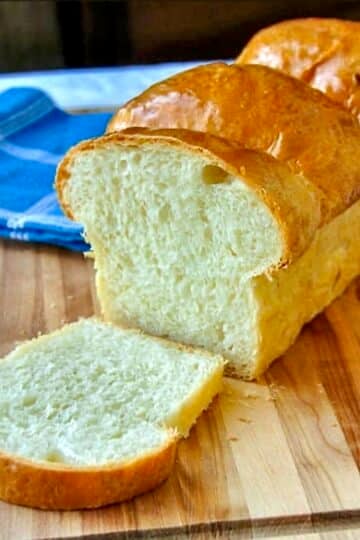 The Best Homemade White Bread close up photo of cut loaf for featured Google image.