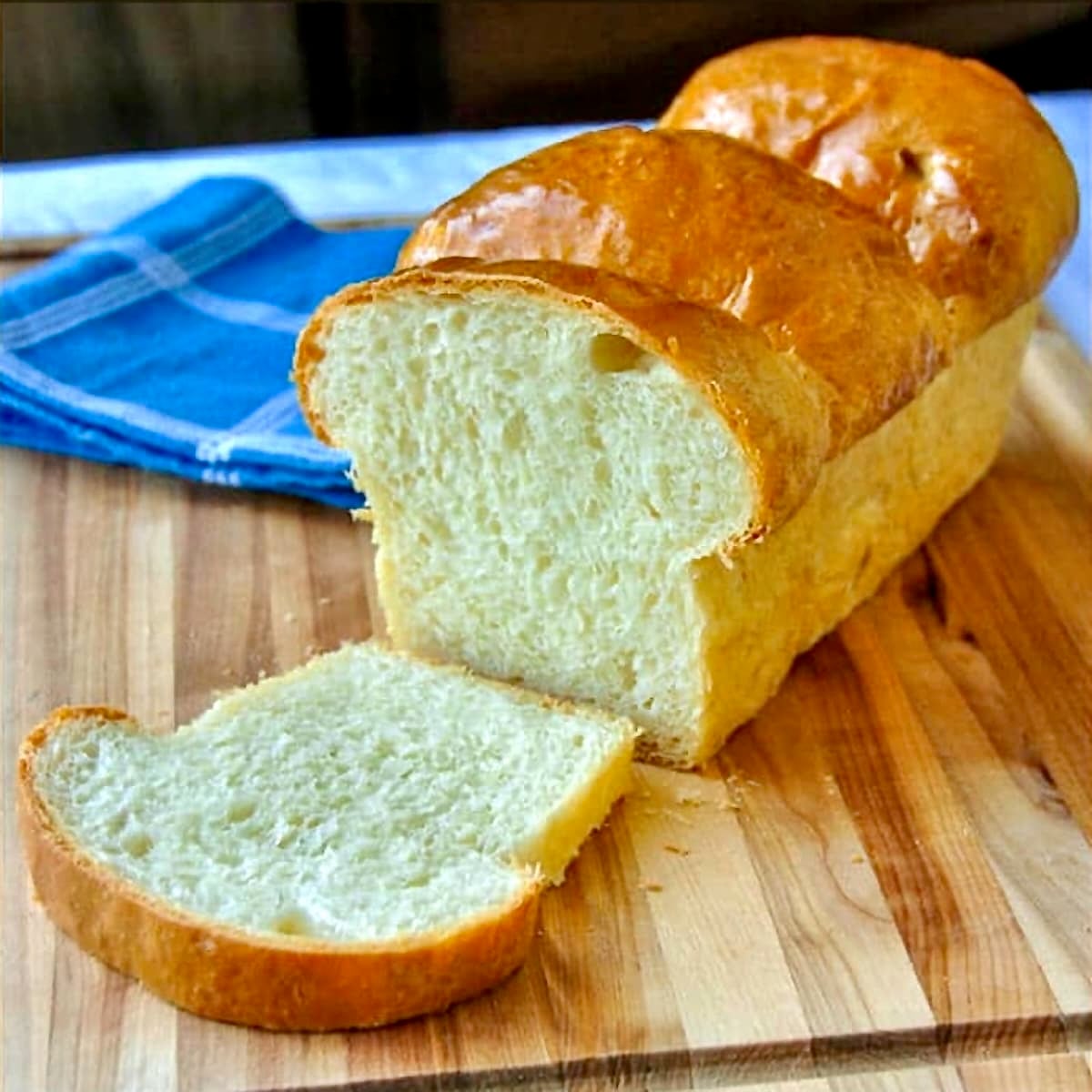 The Best Homemade White Bread close up photo of cut loaf for featured Google image.