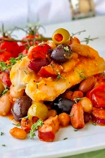 Baked Cod with 5 Beans & Chorizo close up ohoto of one serving.