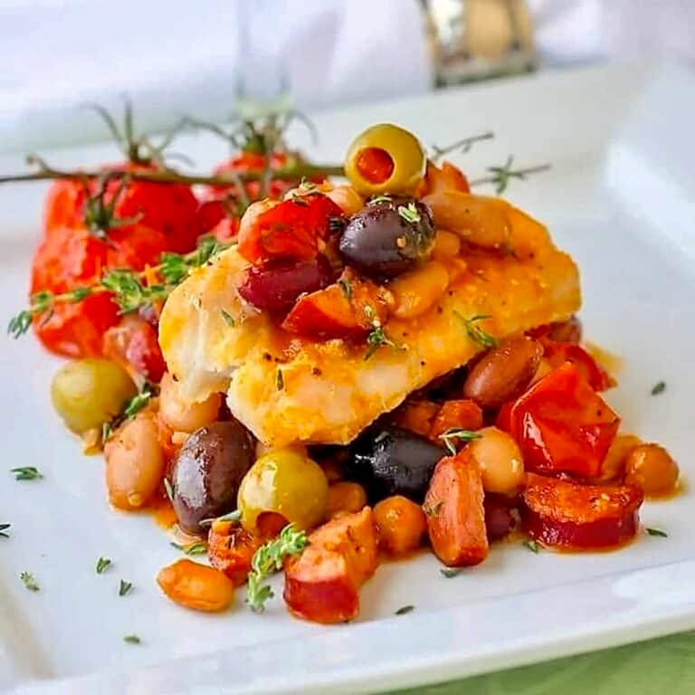 Baked Cod with 5 Beans & Chorizo close up ohoto of one serving.