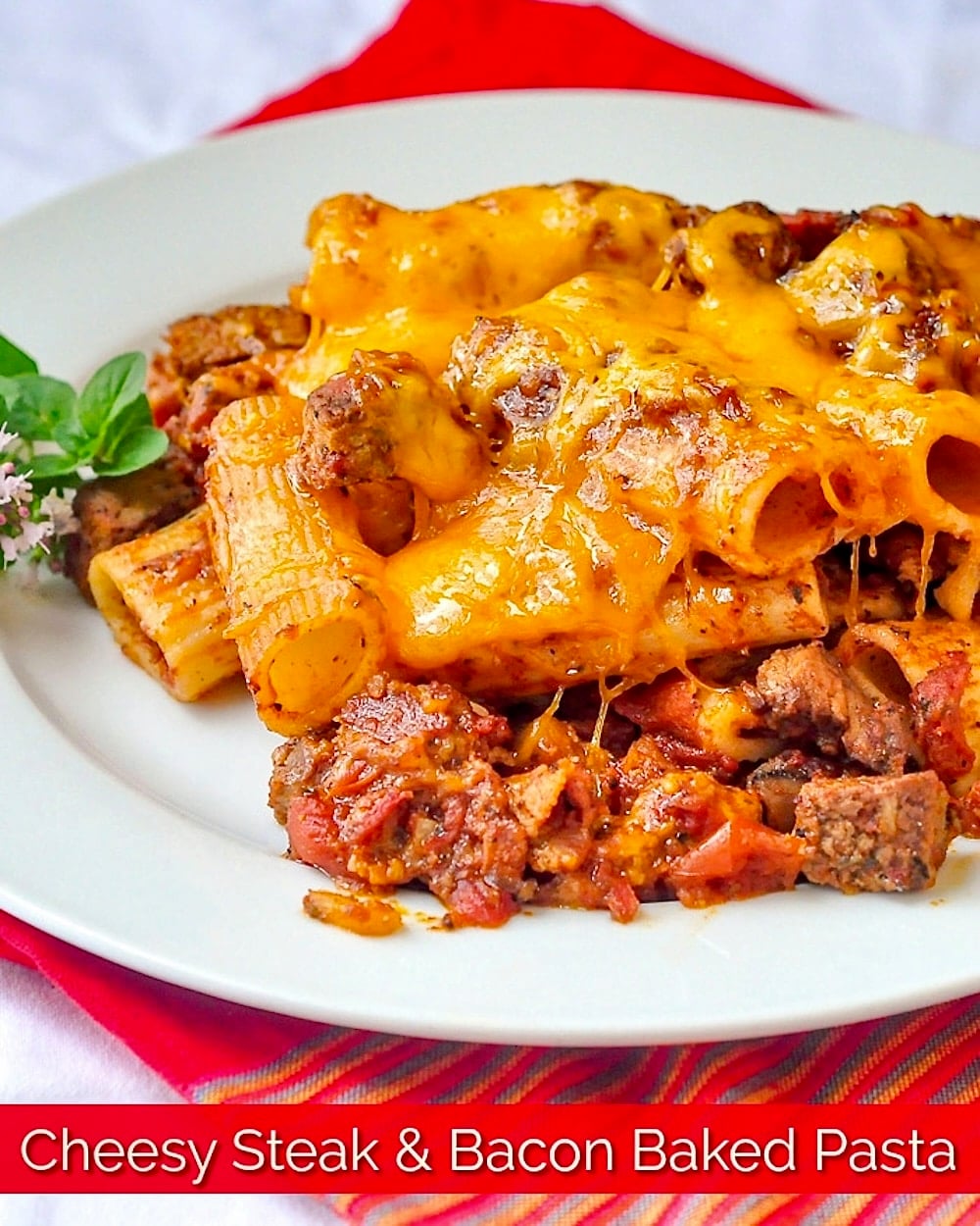 Cheesy Steak & Bacon Baked Pasta photo with title text for Pinterest and social media posts.