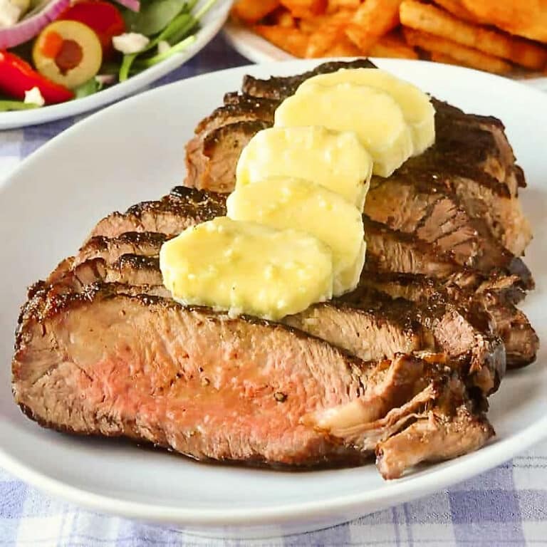 Family Style Garlic Butter Steak close up photo of one family sized steak.