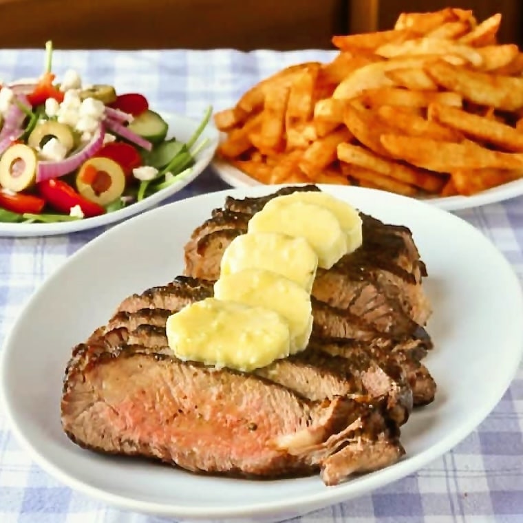 shown with fries and salad.