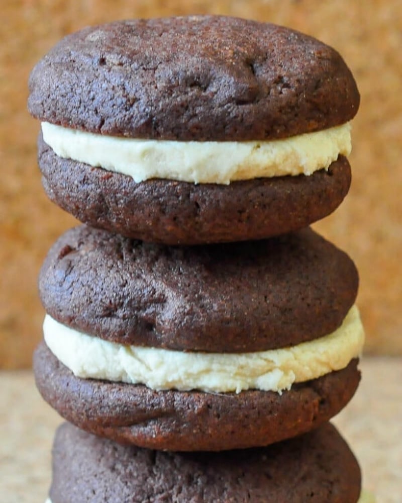 Peanut Butter Cup Sandwich Cookies stacked on top of each other.