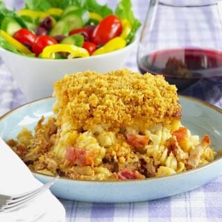 Smoky Chicken Bacon Mac and Cheese 1200 x 1200 cropped photo of a single serving with salad in the background.