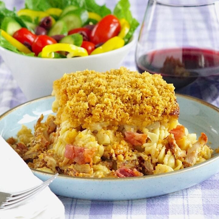 Smoky Chicken Bacon Mac and Cheese 1200 x 1200 cropped photo of a single serving with salad in the background.