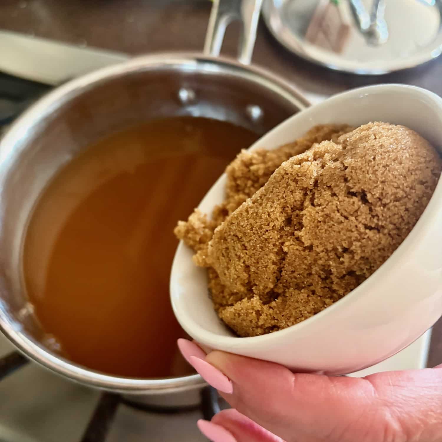 photo oif brown sugar being added to the sauce