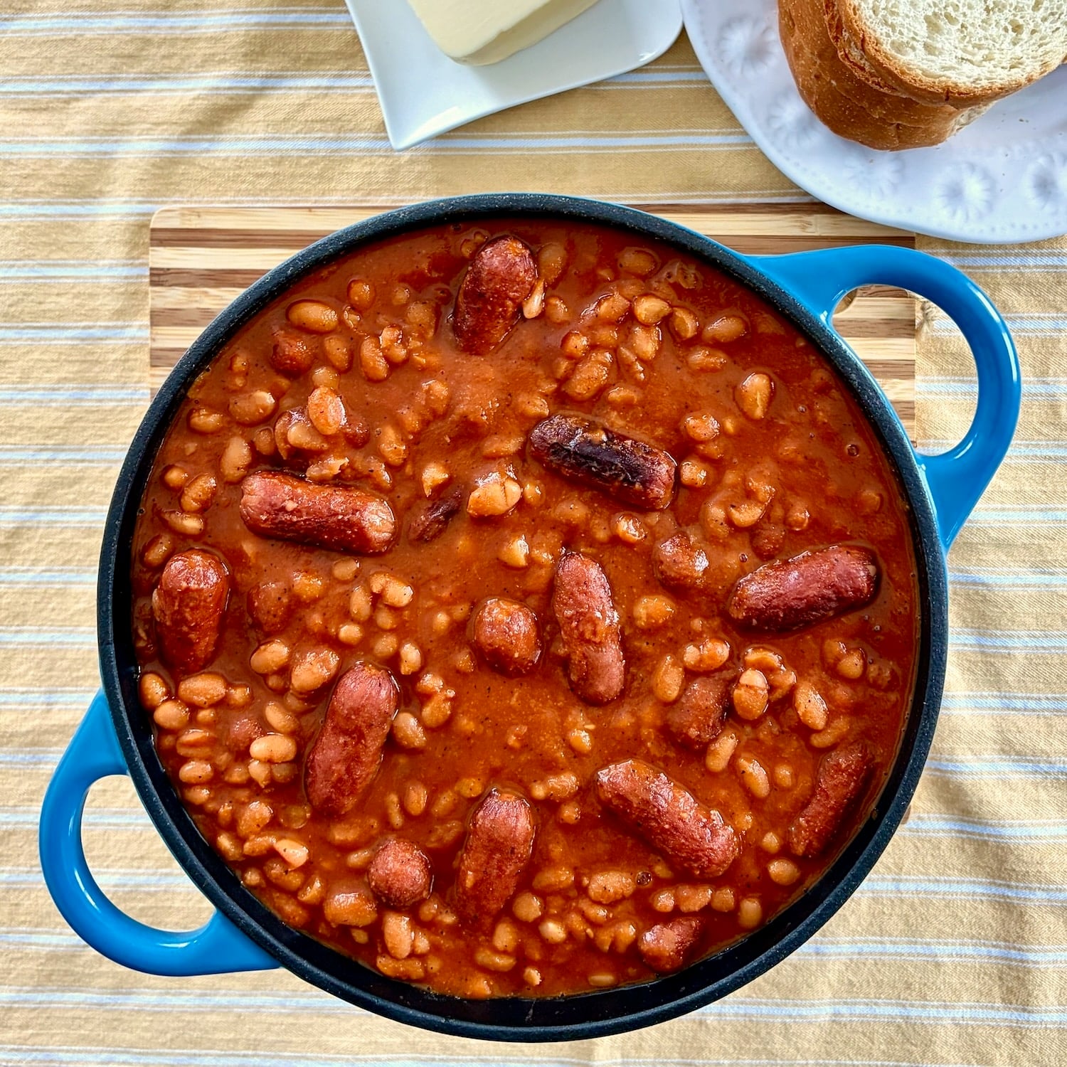 Close up overhead shot of a dutch oven containing the finished Beans and Weiners.
