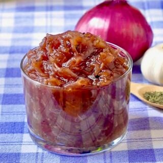 Red Onion Jam l=close up photo in a glass serving dish for featured Google image.