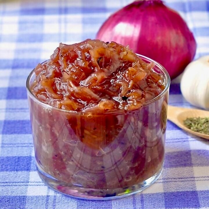 Red Onion Jam l=close up photo in a glass serving dish for featured Google image.