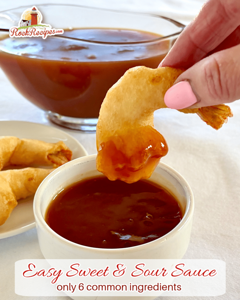 photo of shrimp being dipped in the sauce with title text added for social media posts.