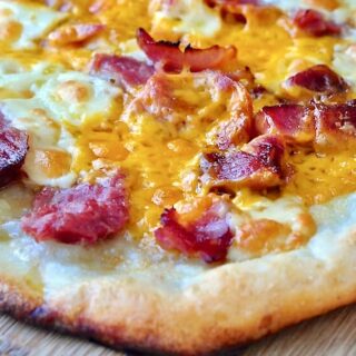 Thin Crust Ham and Cheese Pizza close up photo for featured Google image.