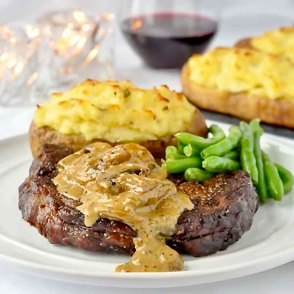 Bourbon Mushroom Sauce on Grilled Rib Eye Steak close up photo of plated dish,