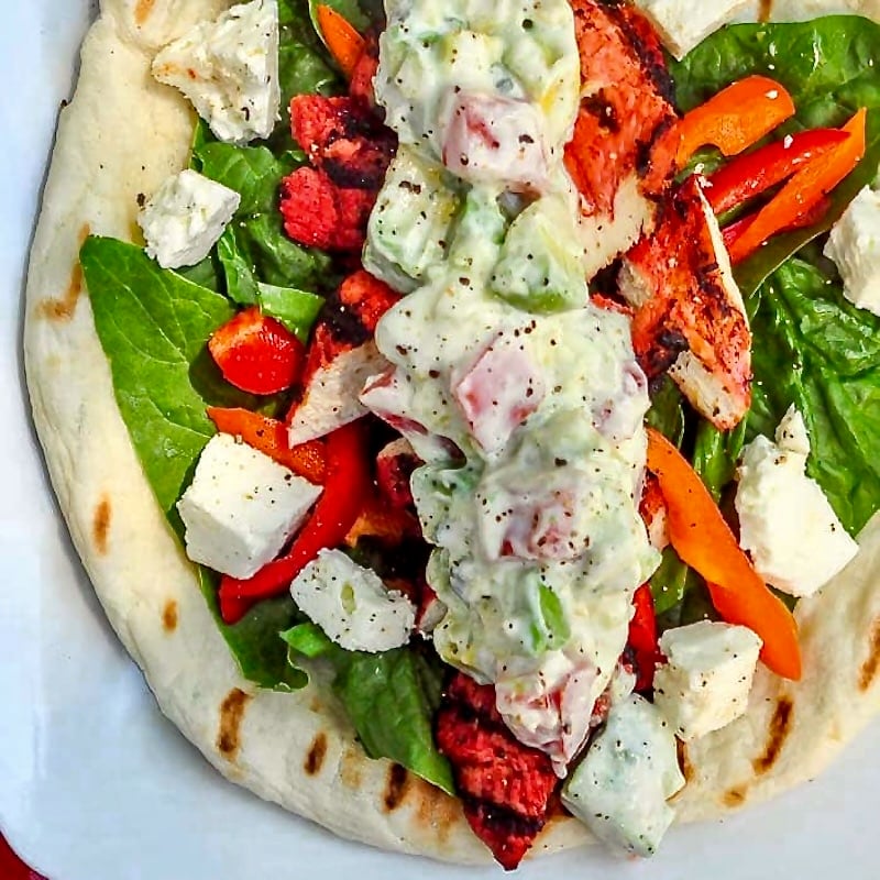 Chicken Souvlaki Wraps with Tomato Avocado Tzatziki overhead photo if one wrap.