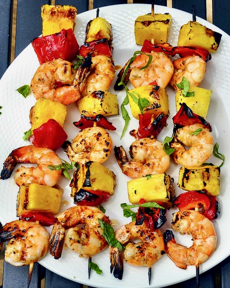 4 Chili Lime Shrimp Kabobs on a white plate.