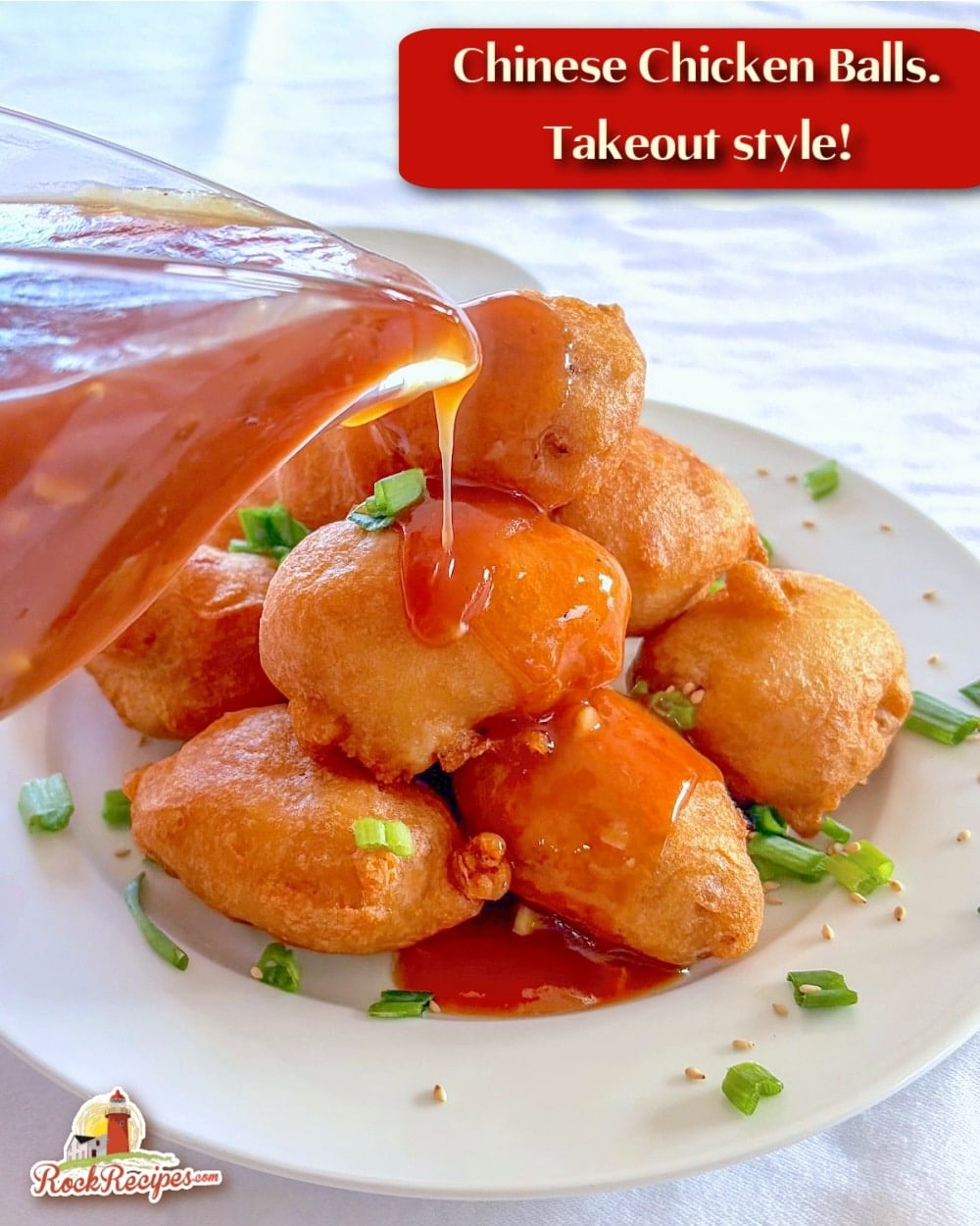 Chinese Chicken Balls photo with balls stacked on a plate with sweet and sour sauce being pored over the top with title text added for social media posts.