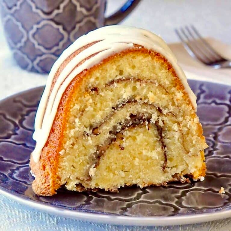 Close up photo of one slice of Cinnamon Roll Cake for Google freatured image.
