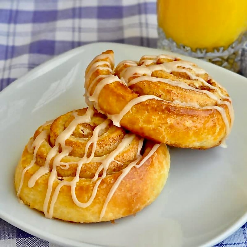 2 Cinnamon Roll Danish in a white plate