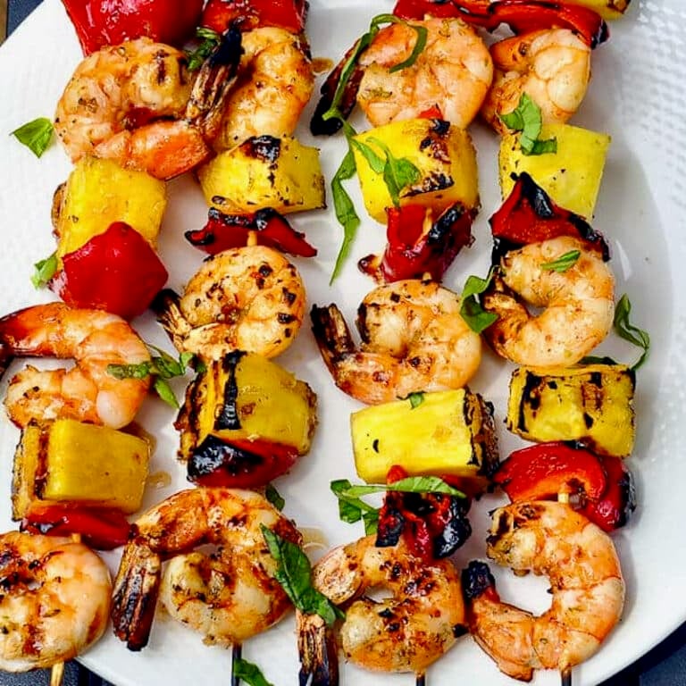 Close up photo of skewers of cooked Chili Lime Shrimp Kabobs.
