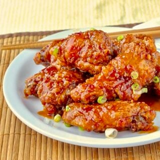 General Tso Chicken Wings close up photo of wings on white plate