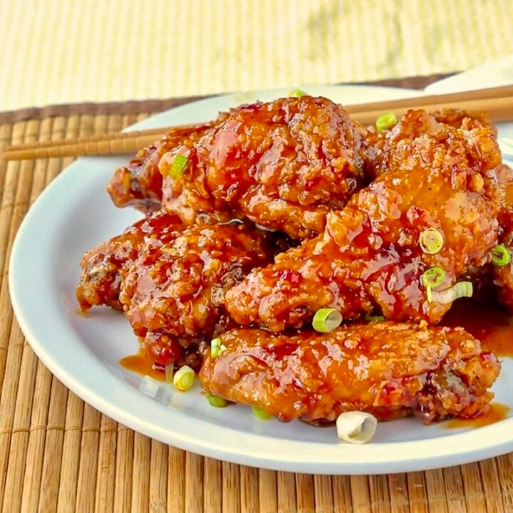 General Tso Chicken Wings close up photo of wings on white plate