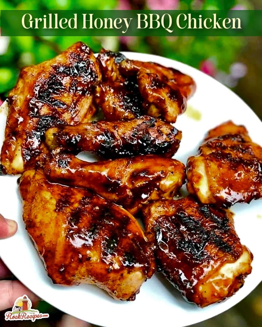 Honey BBQ chicken pieces on a white plate with title text added for social media posts.