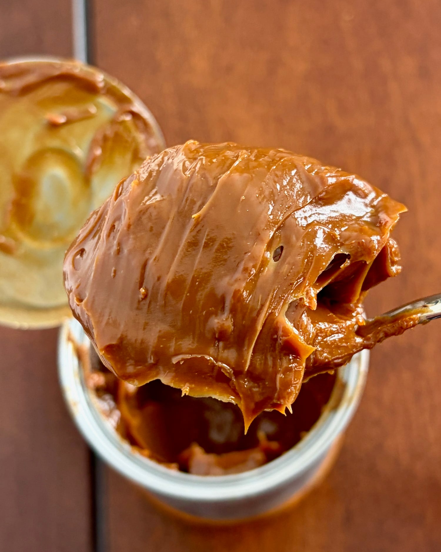 Butterscotch Dulce de Leche scooped up on a tablespoon.