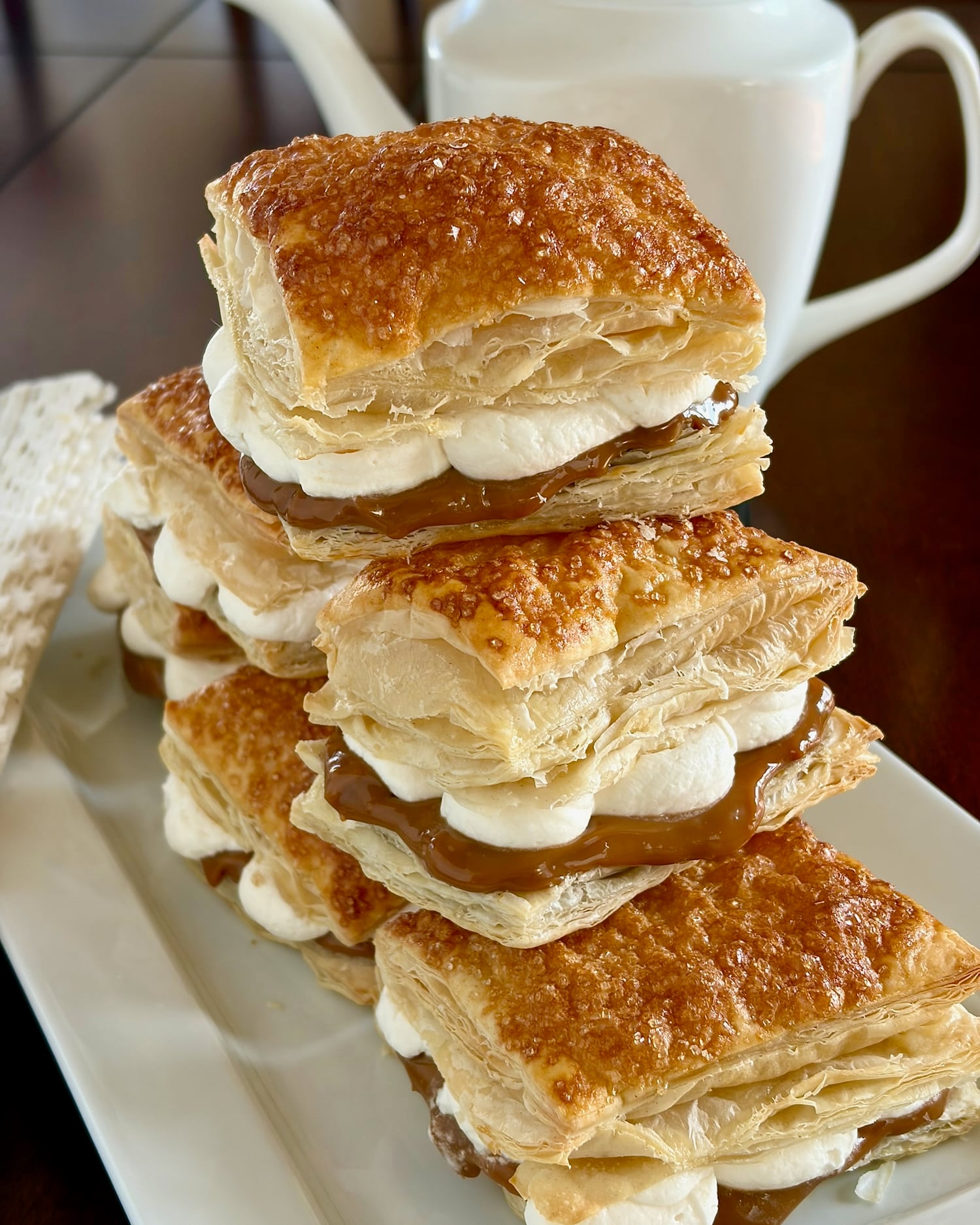 Close up of Dulce de Leche Flakies with coffee pot in background.