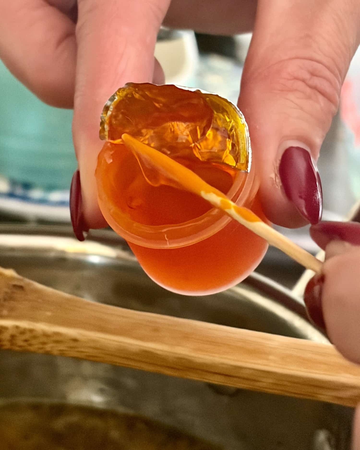 photo of yellow food colouring on a toothpick