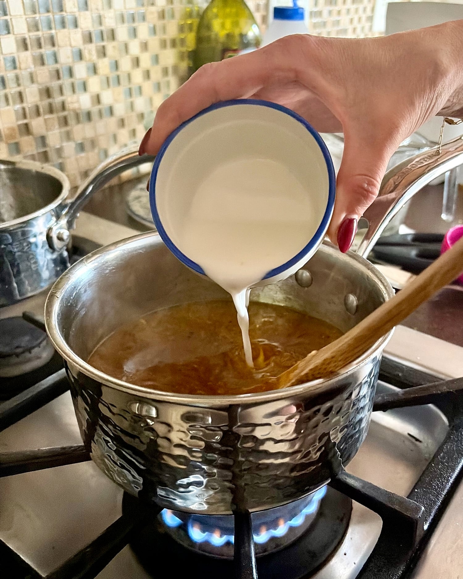 Adding the cornstarch slurry to the best lemon sauce.
