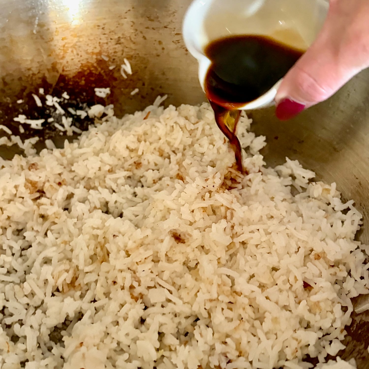 Soy sauce being added to Egg Fried Rice