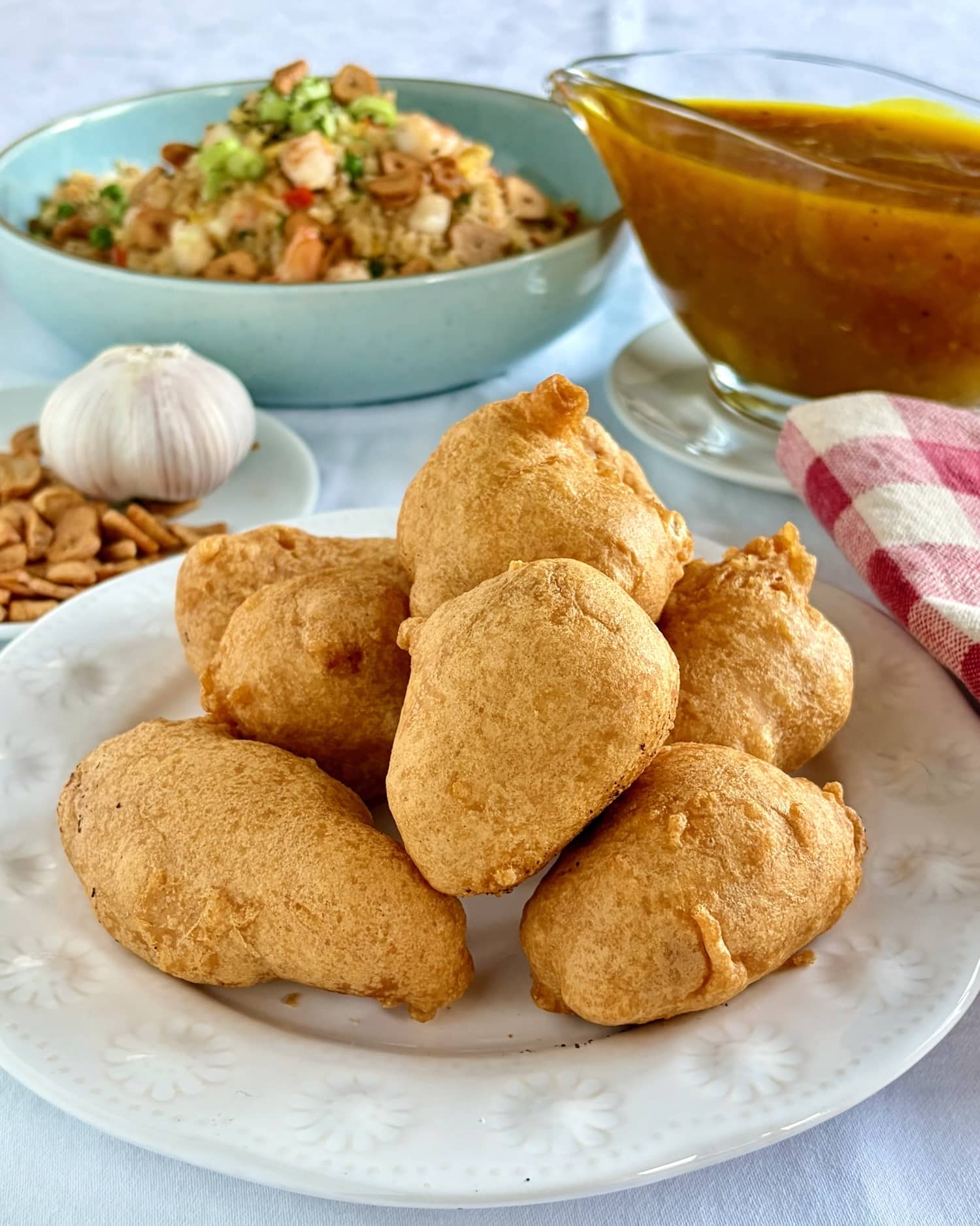 Chinese Chicken Balls with the best lemon sauce and chinese noodles in the background.
