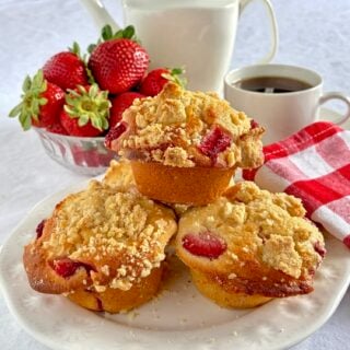 Strawberry Muffins with Shortbread Crumble close up photo of muffins on a white plate.